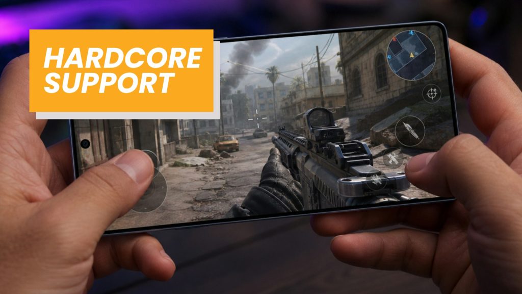 Hands holding a smartphone showing a first-person shooter game set in a ruined city, with a bold orange HARDCORE SUPPORT banner overlay