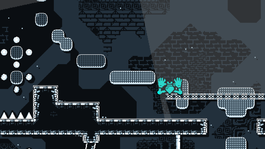 Side-scrolling platformer scene: dark cavern with floating rounded platforms and icy bricks, spikes along the floor, and a blue character at right mid-section ready to jump/descent.